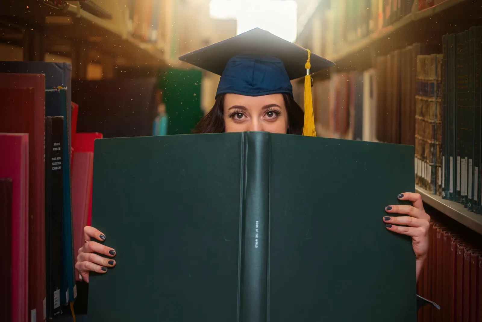 a graduate med student holding a book - how to study for genetics