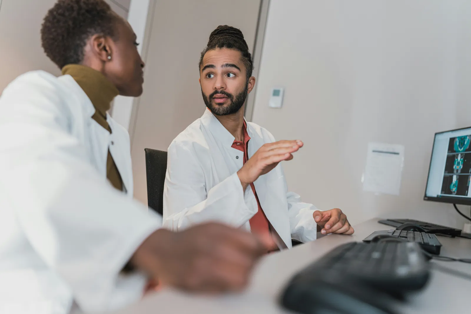 doctors discussing a patient case - how to study microbiology