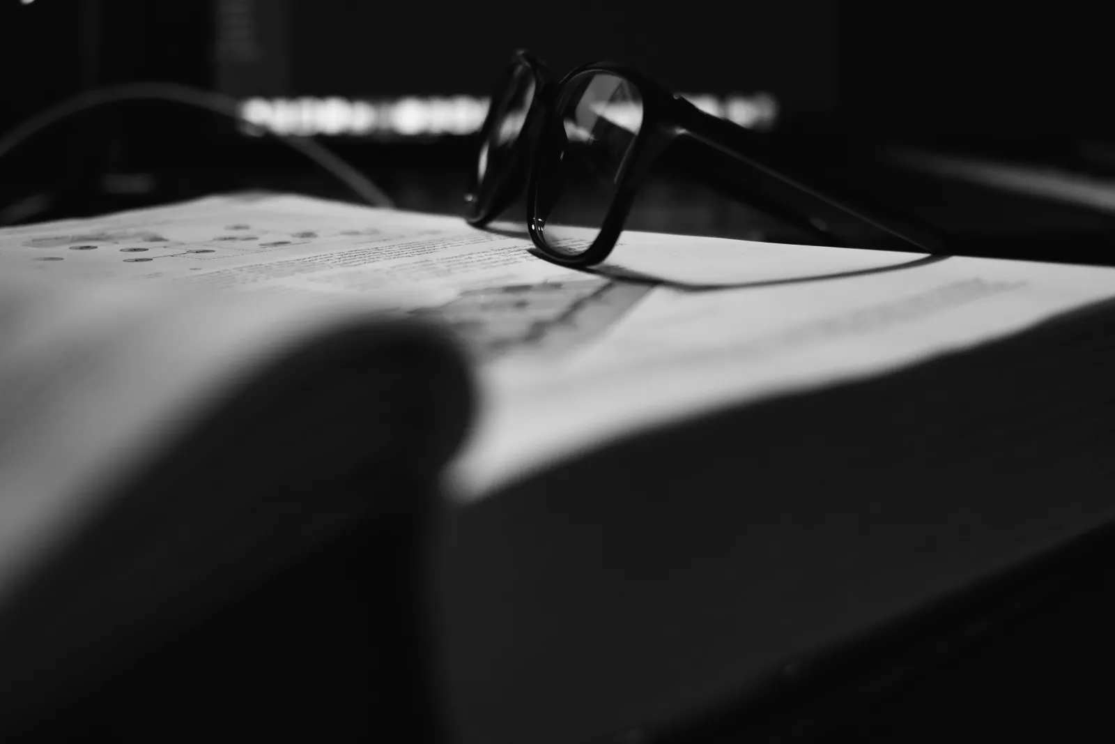 glasses on medical book - how to study physiology